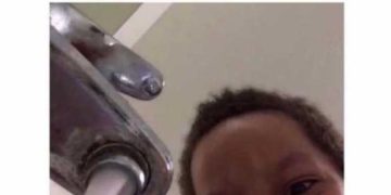 Meme of a child smiling at water running from a faucet, captioned about soaking pans.