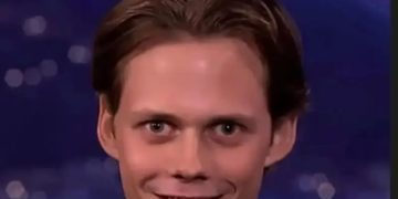 Man with funny, awkward smile after pepper spray joke.