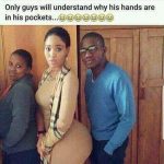 Man standing next to woman with hands in pockets, looking awkward.