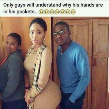 Man standing next to woman with hands in pockets, looking awkward.