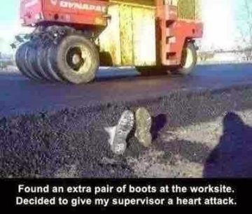 Roller flattens road with boots sticking out in a construction prank.