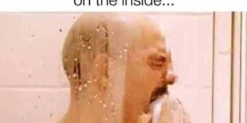 Man in shower crying over shampoo’s unfulfilled promise of repair.