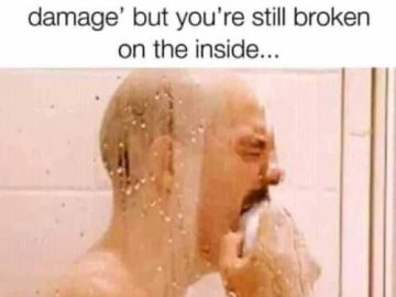 Man in shower crying over shampoo’s unfulfilled promise of repair.