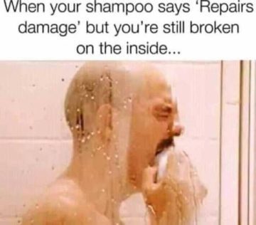 Man in shower crying over shampoo’s unfulfilled promise of repair.