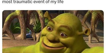 Shrek smiling casually after sharing a traumatic event.