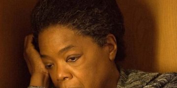 Person waking up tired and confused about sleep benefits.