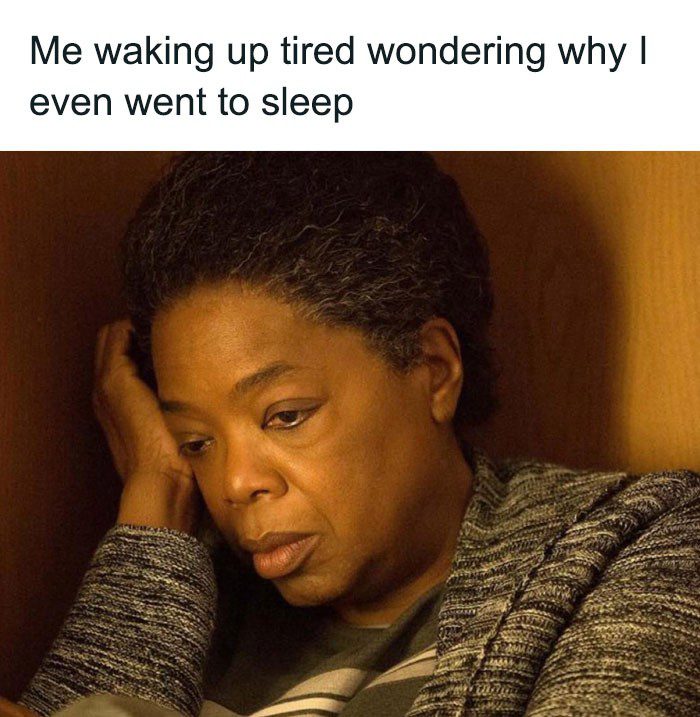 Person waking up tired and confused about sleep benefits.