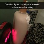 Lotion bottle mistaken for an alarm clock snooze button in dark.