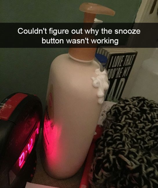 Lotion bottle mistaken for an alarm clock snooze button in dark.