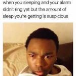 Person waking up confused, thinking they overslept but alarm hasn't rung.