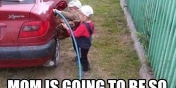 Child attempting to fill car gas tank with water hose.