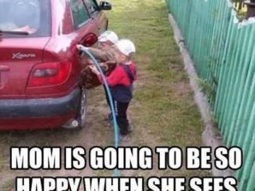 Child attempting to fill car gas tank with water hose.