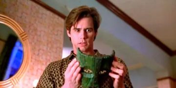 Person holding a mask, captioned "Me getting ready to be fake for work"