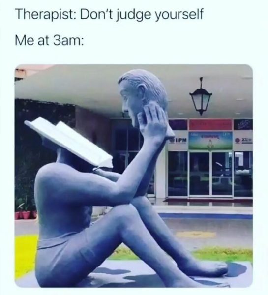 Statue with a book as a head representing self-judgment at 3am
