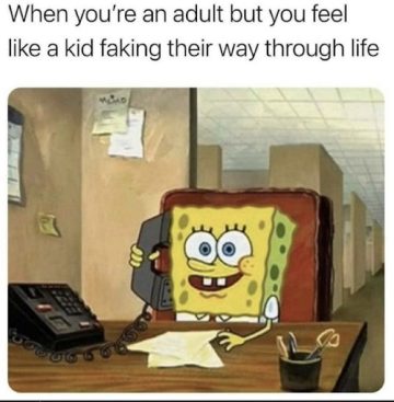 SpongeBob at a desk with phone, feeling like a kid at work.