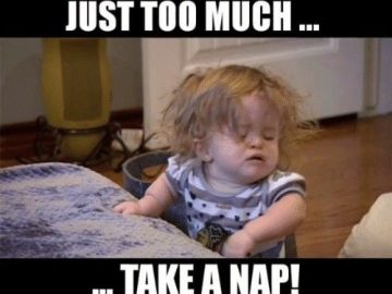 Sleepy child taking a nap, captioned "When life is just too much."