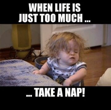 Sleepy child taking a nap, captioned "When life is just too much."