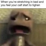 Funny meme of a shocked face reacting to a calf cramp in bed.