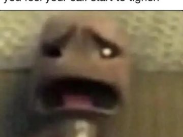 Funny meme of a shocked face reacting to a calf cramp in bed.