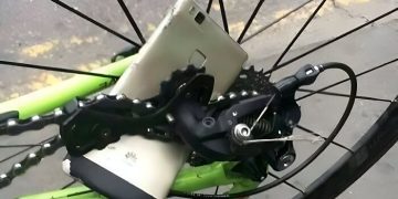 Phone stuck in bike wheel spokes in an epic fail moment.