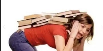 Woman carrying a stack of books on her back, overwhelmed expression.