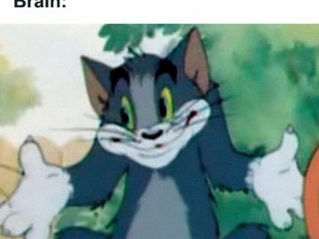 Tom the cat with a shrugging expression representing memory lapse.