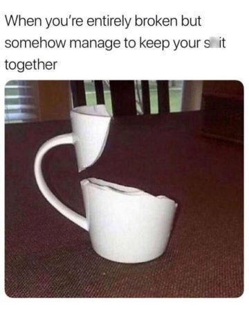 Broken cup still standing, symbolizing holding it together humorously.