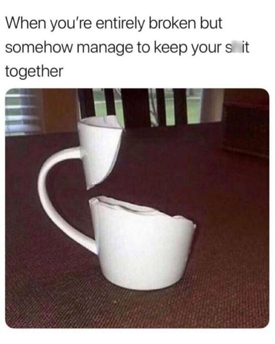 Broken cup still standing, symbolizing holding it together humorously.