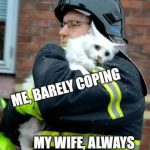 Firefighter holding a white cat, with text "Me, Barely Coping"