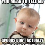 Baby looking confused, questioning why spoons don't sound like airplanes.