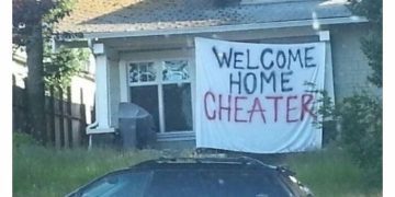 Dog jealousy meme with "Welcome Home Cheater" sign on house.