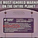 Nintendo Game Pak with ignored warning about blowing on it.