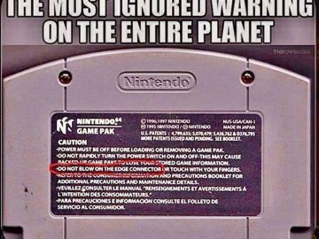 Nintendo Game Pak with ignored warning about blowing on it.
