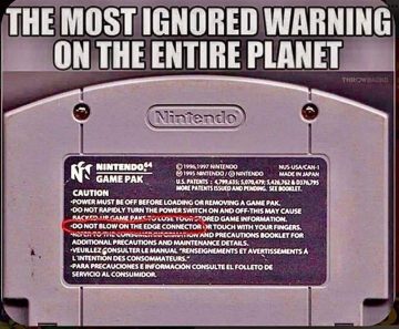 Nintendo Game Pak with ignored warning about blowing on it.