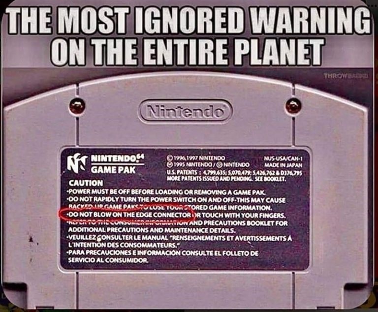 Nintendo Game Pak with ignored warning about blowing on it.