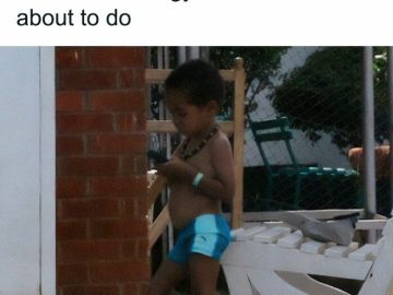 Child looking at phone for music to match chore energy