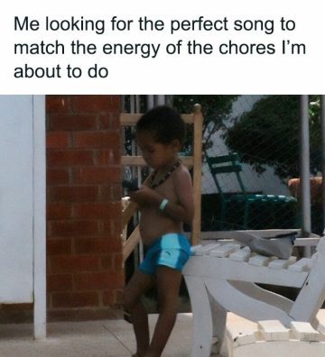 Child looking at phone for music to match chore energy