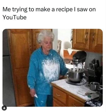 Elderly woman covered in flour after a baking fail in the kitchen.