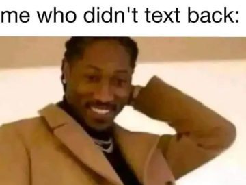 Smiling person realizing they forgot to text back.