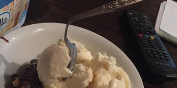 Melty ice cream with fork sticking out, symbolizing freezer fail.