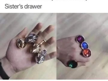Hand holding toy rings, jokingly called Infinity Stones.