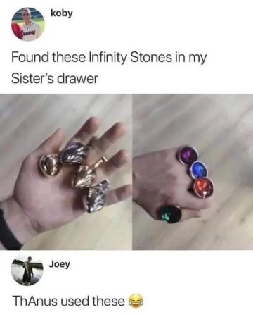 Hand holding toy rings, jokingly called Infinity Stones.