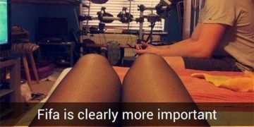 Person focused on gaming instead of spending time with their partner.