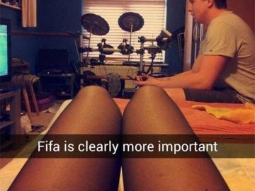 Person focused on gaming instead of spending time with their partner.