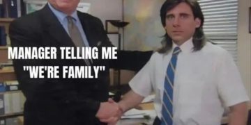 Manager telling employee "We're family" with employee looking disinterested