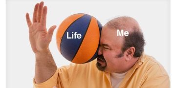 Man getting hit by a basketball labeled "Life" representing a life shock.