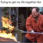 Man in red jacket trying to extinguish a Christmas tree fire