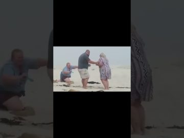 Thumbnail for a funny beach proposal video showing a romantic moment turning into sudden chaos and an awkward fail