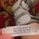 Fortune cookie message about taking a big step with a foot cast.