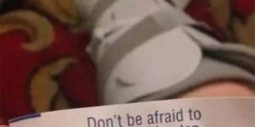 Fortune cookie message about taking a big step with a foot cast.